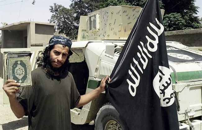 This undated image made available in the Islamic State's English-language magazine Dabiq, shows Belgian Abdelhamid Abaaoud. Abated who was identified by French authorities on Monday, Nov. 16, 2015, is the presumed mastermind of the attacks last Friday in Paris. A senior police official on Wednesday, Nov. 18, 2015, said he believed the Belgian Islamic State militant was inside an apartment in the Paris suburb of Saint-Denis with other heavily armed people.