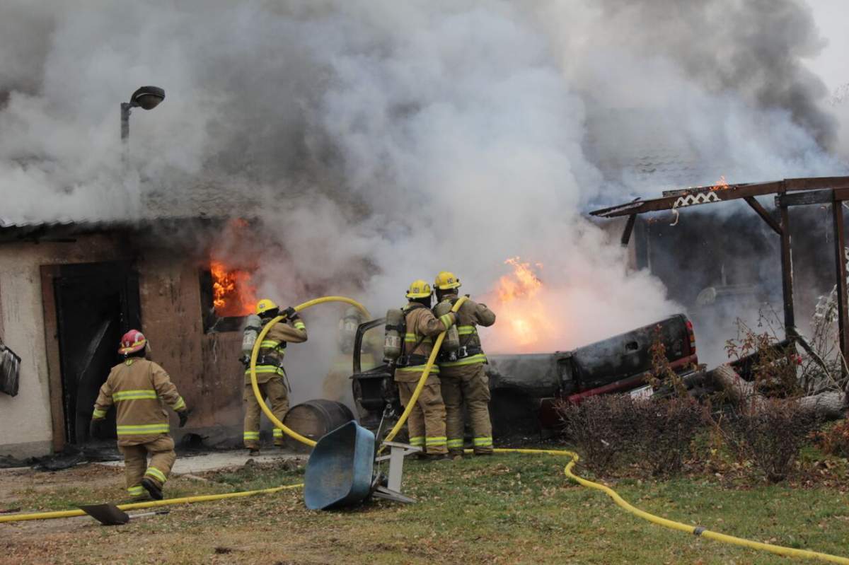 A home near Brooks, Alta. caught fire on Wednesday, Nov. 4, 2015 after a pickup  crashed into the exterior. 