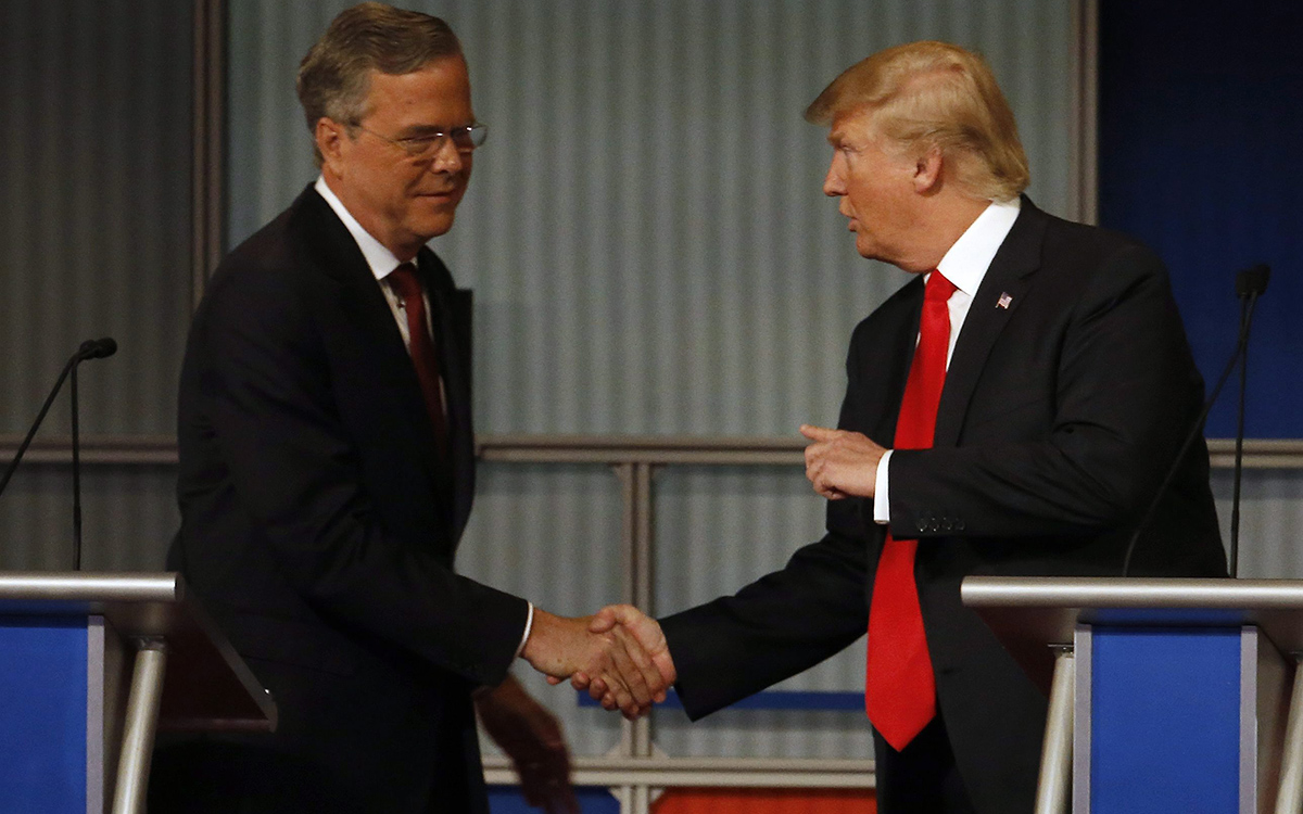 Jeb Bush and Donald Trump shake hands after the Republican presidential debate at the Milwaukee Theatre, Tuesday, Nov. 10.