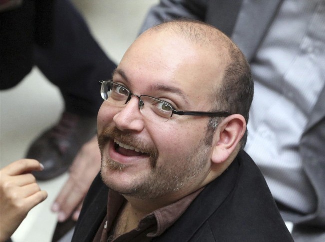 FILE - In this photo April 11, 2013 file photo, Jason Rezaian, an Iranian-American correspondent for the Washington Post, smiles as he attends a presidential campaign of President Hassan Rouhani in Tehran, Iran. 