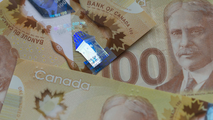 A photo of Canadian $100 bills. Mounties in Kamsack say fake $100 bills have surfaced in the Saskatchewan community.