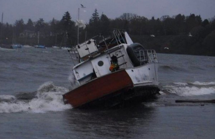 A boat that tipped over on Cadboro Bay Beach spilled needles, causing the beach to be closed indefinitely by the District of Saanich .