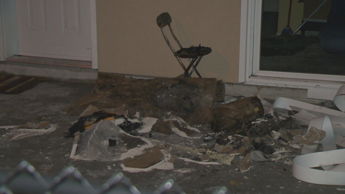 Charred debris can be seen strewn in front of a carriage house in the 700 block of Coronation Avenue in Kelowna. A space heater ignited a stack of papers causing much smoke damage to the home. 