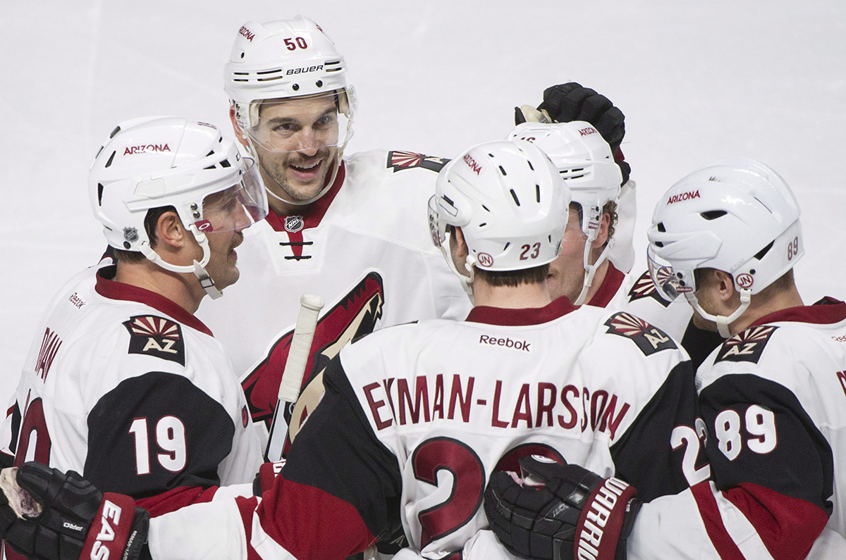 Arizona Coyotes' Oliver Ekman-Larsson (23) celebrates with teammates Shane Doan (19), Antoine Vermette (50) and Mikkel Boedker (89) after scoring against the Montreal Canadiens during the second period.