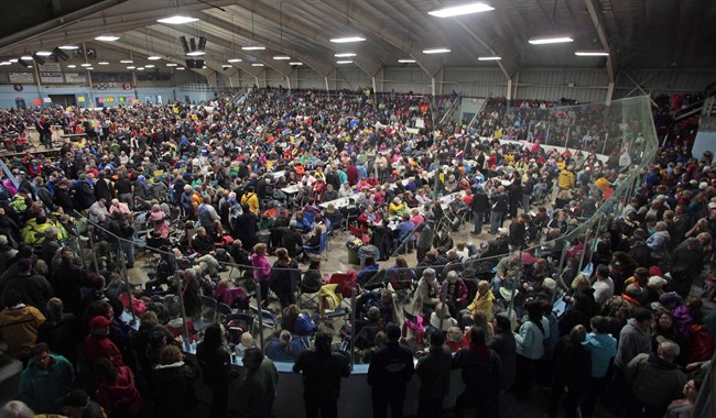 The crowds fill the arena in Inverness, Nova Scotia, waiting for the Chase the Ace darw to start in Inverness, Nova Scotia on Oct. 4, 2015. The final totals are in for a game of Chase the Ace that recently drew thousands to a small Nova Scotia town and sparked a wave of similar lottery games across the region. Committee spokesperson Cameron MacQuarrie says more than 3.5 million tickets were sold for the Chase the Ace fundraiser over its 48-week run in Cape Breton's Inverness.