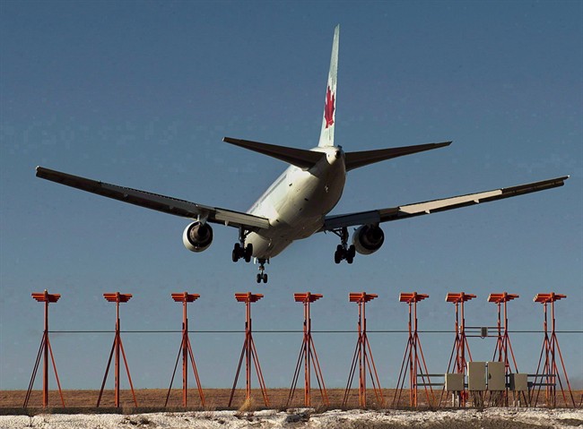 An Air Canada passenger jet lands at Halifax Stanfield International Airport in Halifax on Jan. 21, 2013. 
