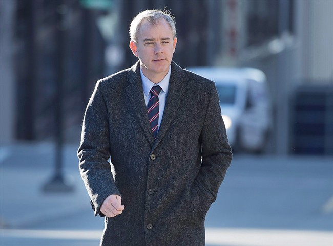 Dennis Oland heads to the Law Courts as his murder trial continues in Saint John, N.B. on Tuesday, Nov. 10, 2015. 