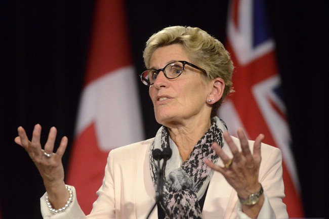 Ontario Premier Kathleen Wynne speaks during a media availability at Queen's Park in Toronto, Thursday, Oct, 1, 2015. 