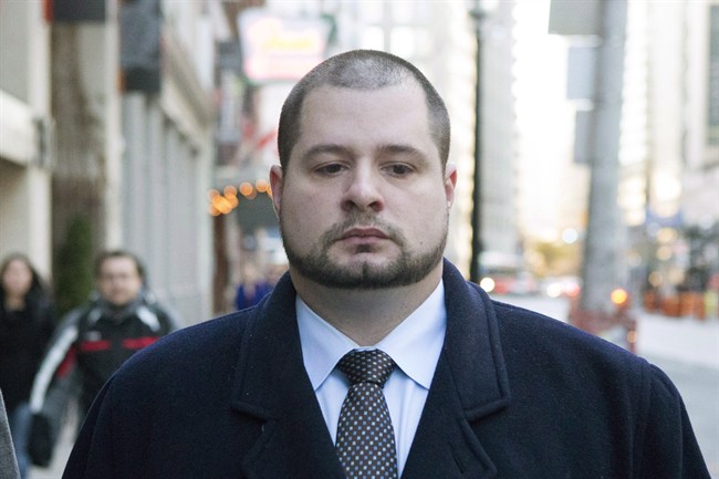 Toronto police officer James Forcillo arrives at Toronto Police Headquarters to attend the opening of a disciplinary hearing on Thursday November 7, 2013. 