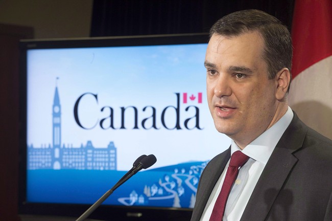 Industry Minister James Moore speaks at a news conference in Toronto on March 6, 2015. Former federal industry minister and British Columbia MP Moore has landed a new job. He has joined Dentons, an international law firm with offices across North America, Europe, the Middle East, Africa and the Asia-Pacific. THE CANADIAN PRESS/Frank Gunn.