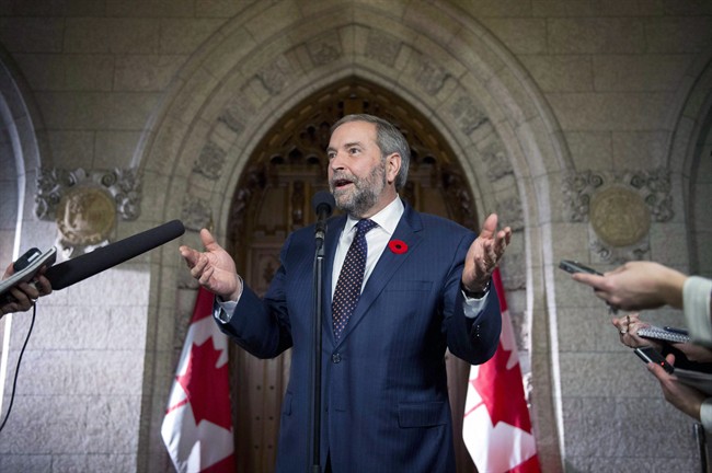 FILE -- NDP Leader Tom Mulcair speaks to reporters in the foyer on Parliament Hill, shortly after addressing his caucus, on Wednesday, Nov. 4, 2015, in Ottawa. THE CANADIAN PRESS/Justin Tang.