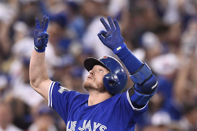 FILE -- Toronto Blue Jays' Josh Donaldson reacts as he crosses the plate after hitting a two-run home run against the Kansas City Royals during third inning game three American League Championship Series baseball action in Toronto on Monday, Oct. 19, 2015. Donaldson has been named the American League MVP. THE CANADIAN PRESS/Frank Gunn.