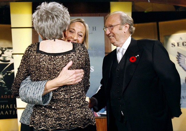 Author Elizabeth Hay, centre, is congratulated by author Alice Munro, left, and Giller Prize founder Jack Rabinovitch, right, after accepting the Giller Prize for Canadian literature for her book Late Nights on Air in Toronto, Tuesday, November 6, 2007. Since the Giller's inception in 1994, founder Rabinovitch has been sending out one long-stem red rose with each gala invite, along with decorating the annual black-tie soiree with the flower. THE CANADIAN PRESS/J.P. Moczulski.