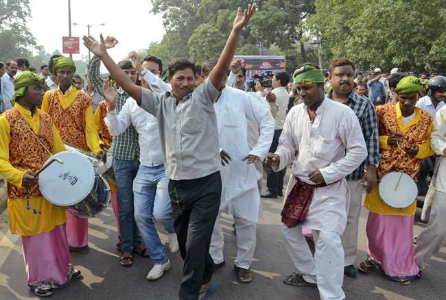Supporters of an alliance of parties opposed to India’s ruling Bharatiya Janata Party celebrate as early results of Bihar state elections indicate victory for them in Patna, India, Sunday, Nov. 8, 2015. 