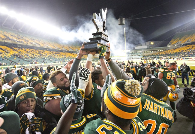 Edmonton Eskimos celebrate the win over the Calgary Stampeders during the CFL West Division final in Edmonton.
