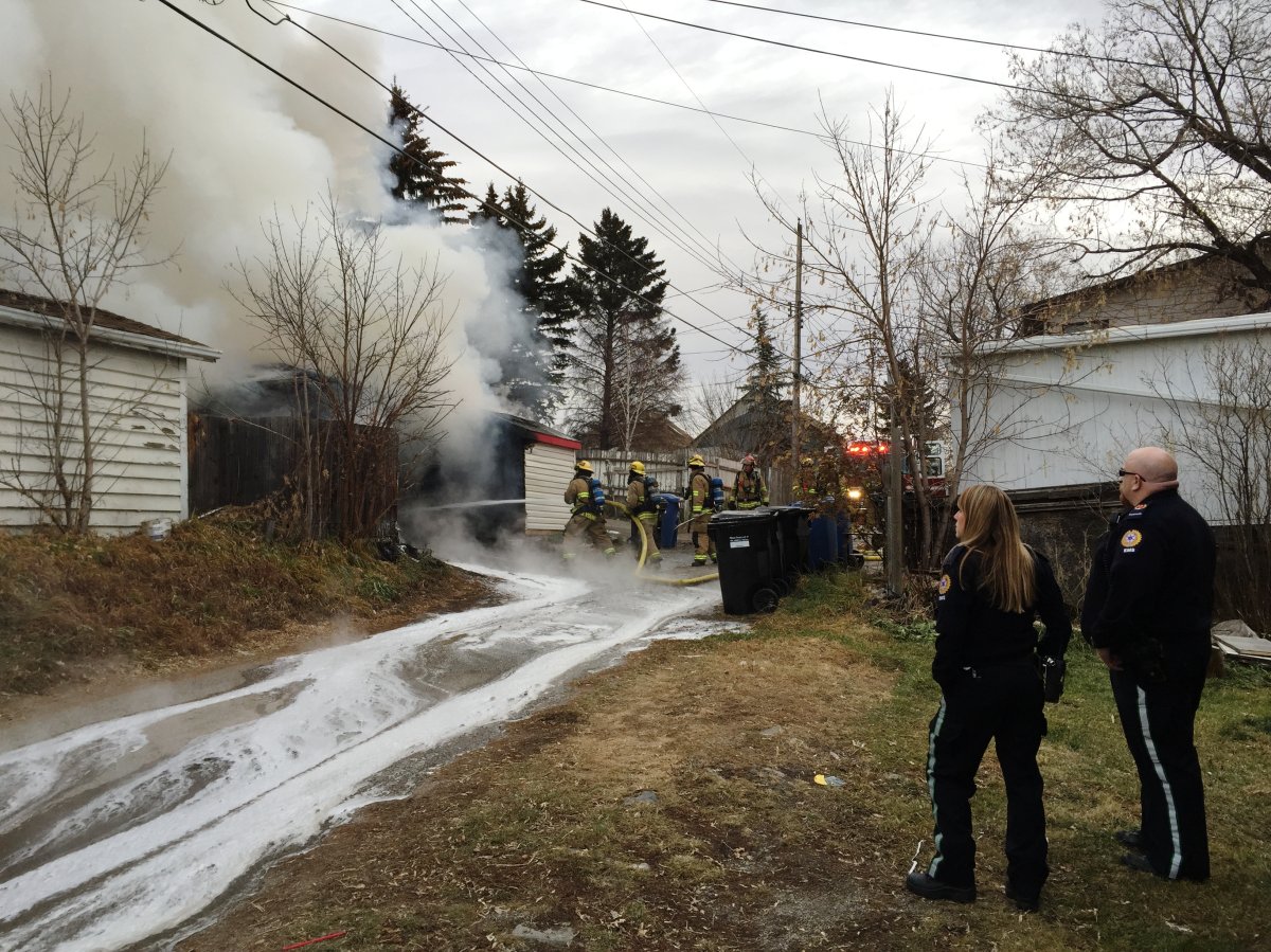 Firefighters battle a fire in the 2800 block of 11 Avenue S.E. on Tuesday, Nov. 17, 2015. 