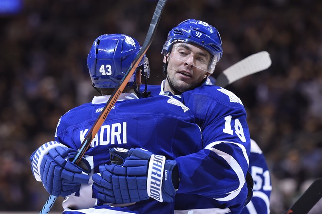 Toronto Maple Leafs' Nazem Kadri, left, congratulates teammate Joffrey Lupul on his second goal against the Dallas Stars during second period NHL hockey action in Toronto, Monday, Nov. 2, 2015. 