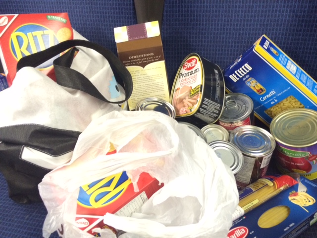 Examples of food being collected during the 21st annual ETS Stuff a Bus campaign. November 25, 2015.