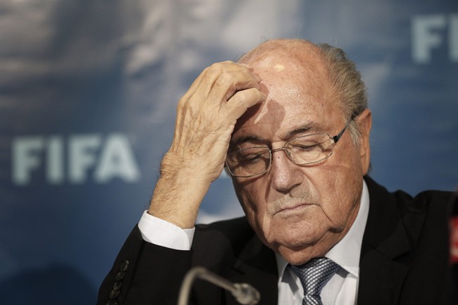In this Dec. 19, 2014 file photo FIFA President Sepp Blatter gestures as he attends a press conference in Marrakech, Morocco. 