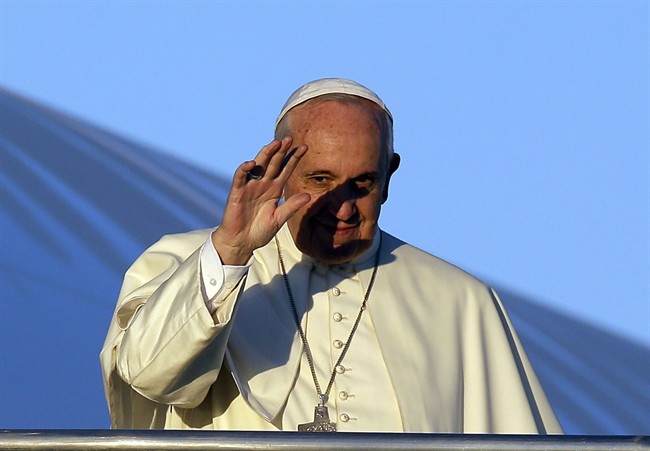 Pope Francis waves to journalists as he boards his airplane on the occasion of his trip to Africa, at Rome's Fiumicino International Airport, Wednesday, Nov. 25, 2015. Pope Francis is leaving for a trip that will take him to Kenya, Uganda and the Central African Republic, from Nov. 25-30.