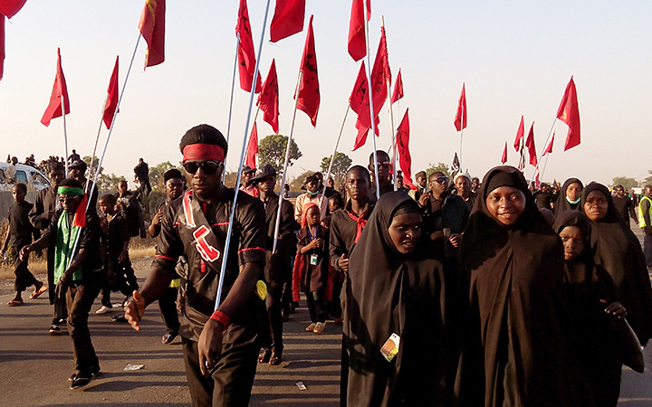 Shiite Muslims march on a highway on November 27, 2015 in northern Nigeria. A Boko Haram suicide bomber killed at least 21 Shiite Muslims during a similar procession and promised more attacks on opponents of its radical form of Islam.