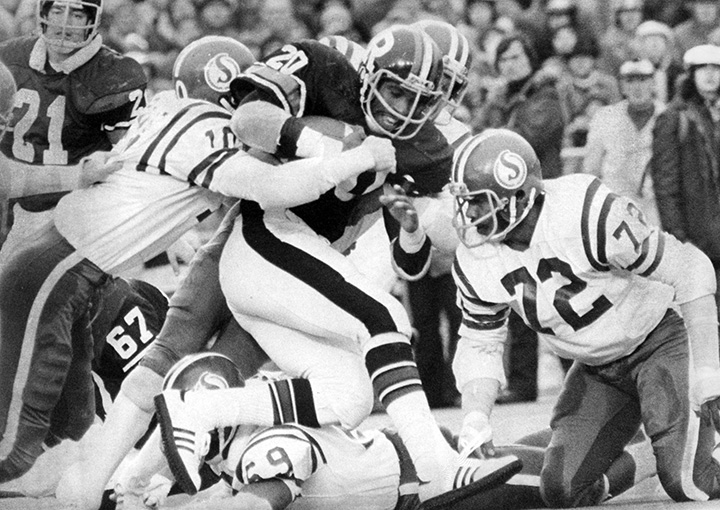 Ottawa’s Gary Kuzyk is hit by Ted Provost and Cleveland Vann of the Saskatchewan Roughriders in the 1976 Grey Cup in Toronto on Nov. 28, 1976.