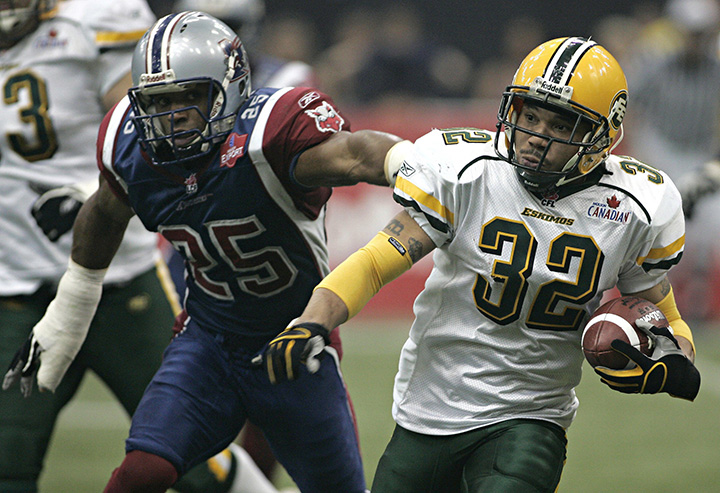 Montreal Alouettes Duane Butler reaches for Edmonton Eskimos Troy Davis during 3rd quarter of CFL Grey Cup action on Sunday, Nov. 27, 2005 in Vancouver.
