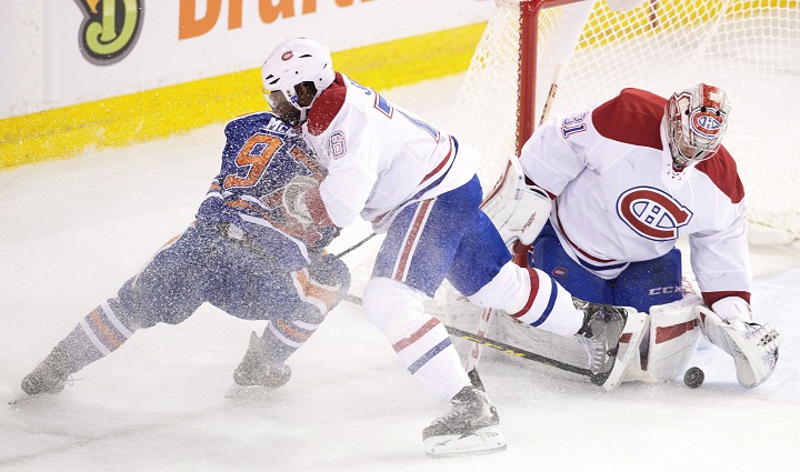 In this file photo, Montreal Canadiens' P.K. Subban (76) defends against Edmonton Oilers' Connor McDavid (97) as goalie Carey Price (31) makes the save during second period NHL action in Edmonton, Alta., on Thursday October 29, 2015.