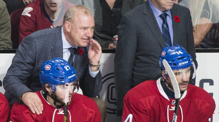 Montreal Canadiens head coach Michel Therrien alongside players Alex Galchenyuk and Tomas Plekanec during an NHL hockey game against the New York Islanders in Montreal, Thursday, November 5, 2015.