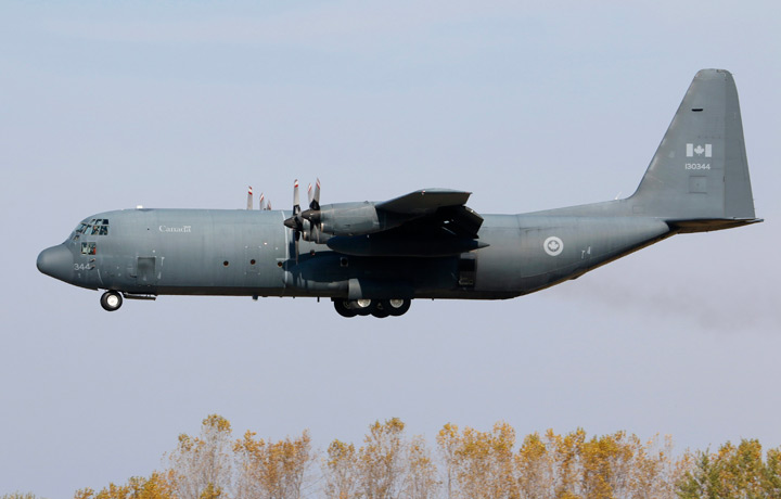A C-130H (CC-130H-30) Hercules transport, belonging to the RCAF (Royal Canadian Air Force) lands at CFB Trenton, Ontario on Oct. 14 2014. 