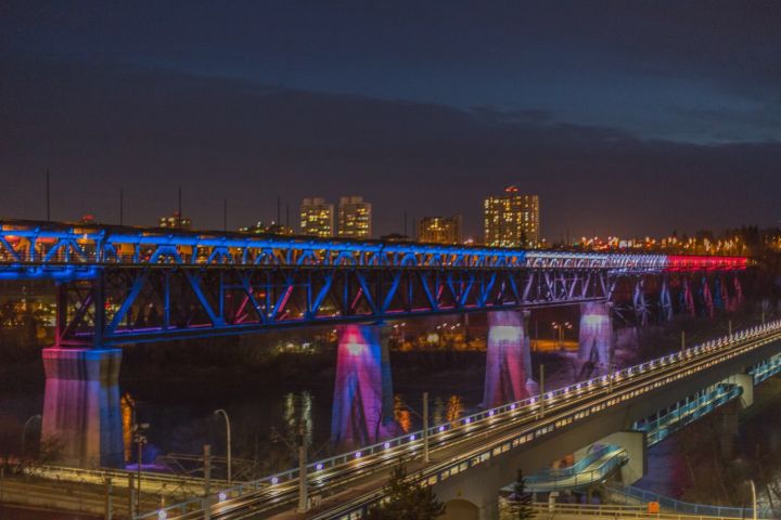 Edmonton's High Level Bridge lit up in blue, white and red lights to honour victims of Paris attacks.