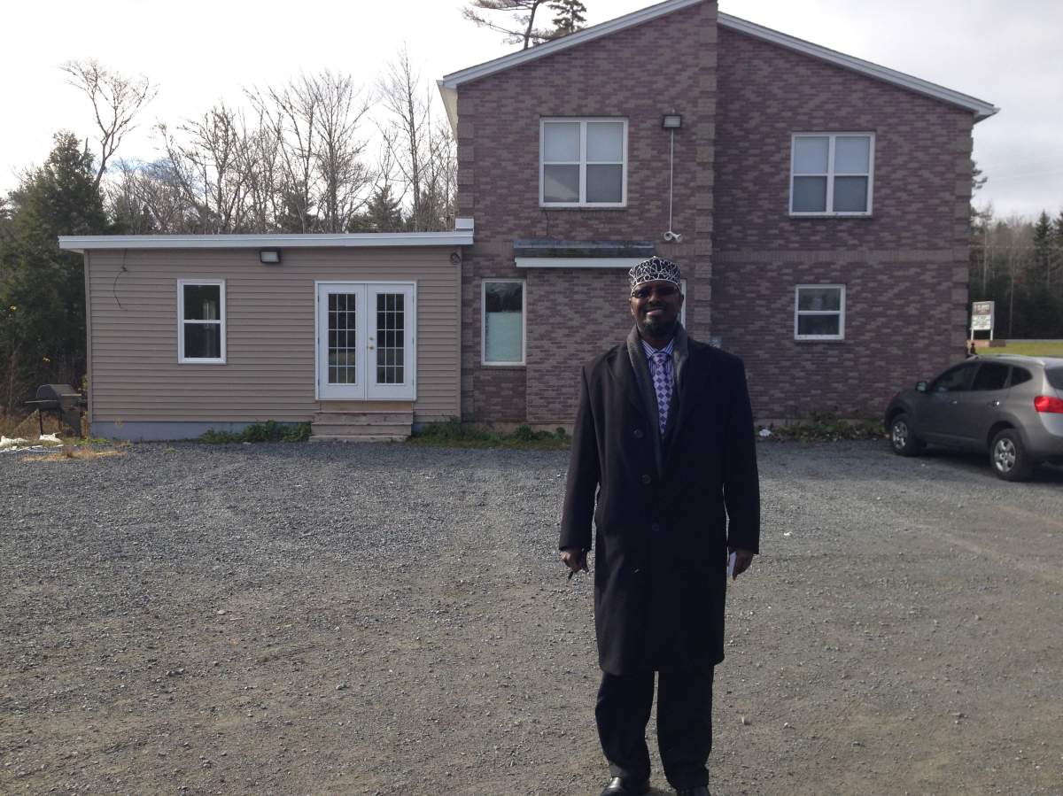 Imam Adam Esse stands in front of The Nova Scotia Islamic Community Centre Mosque