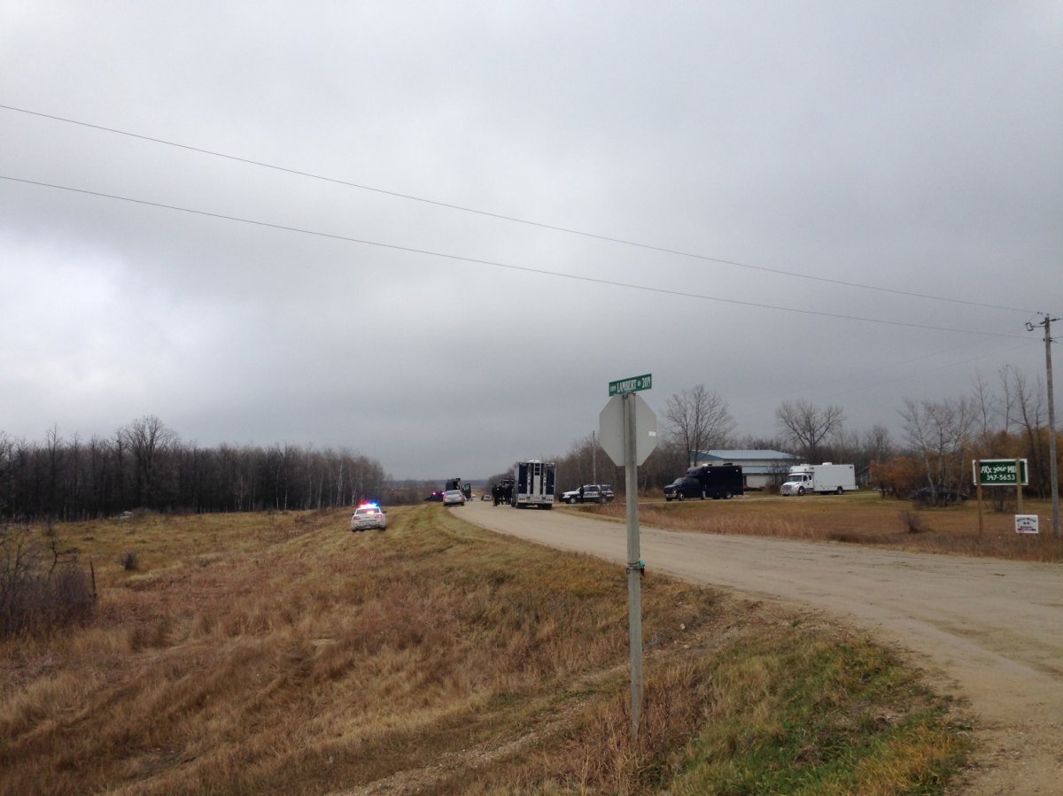 A large police presence on a road just south of St.Malo, Manitoba on November 2, 2015.
