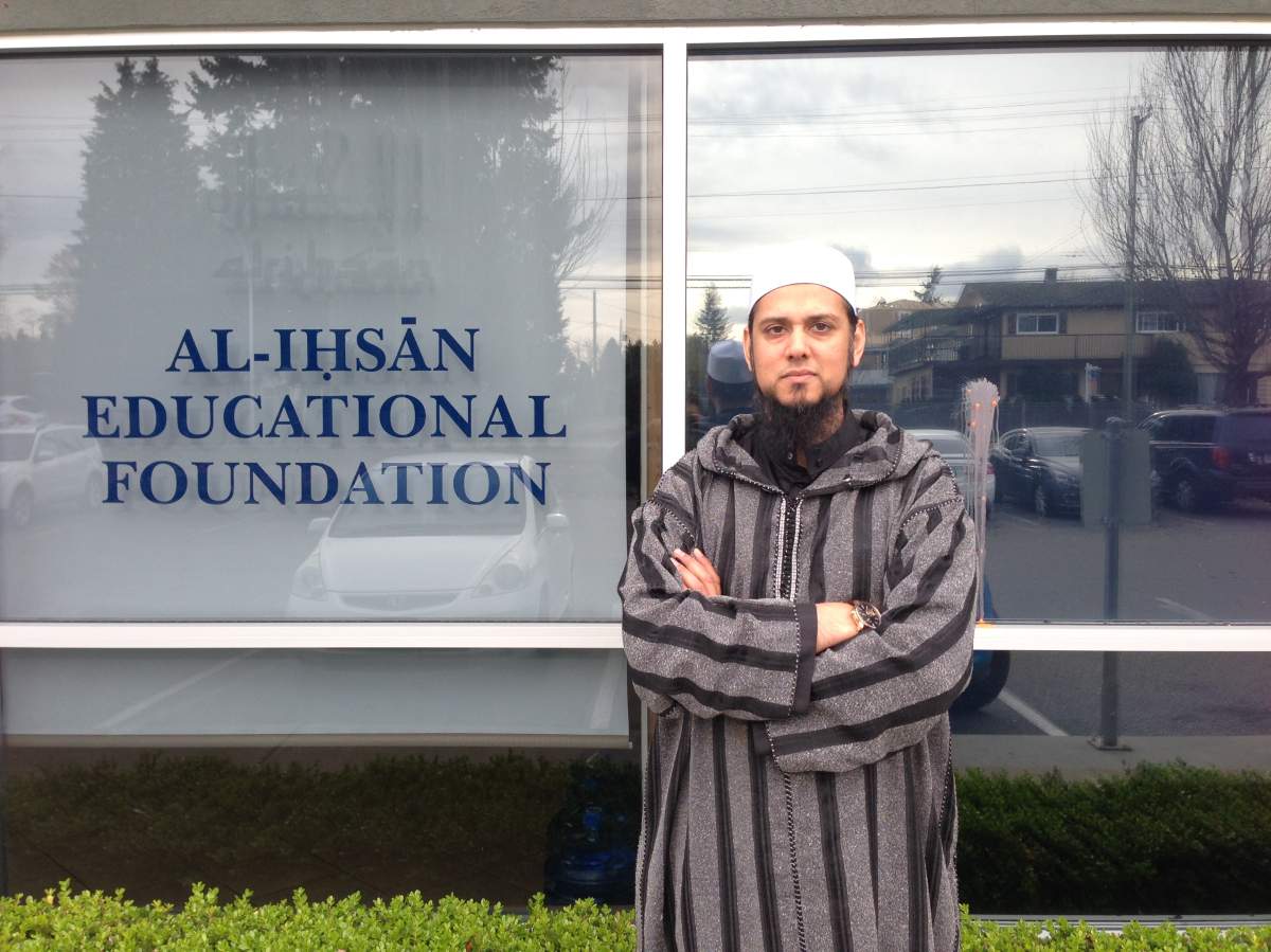 Mufti Aasim Rashid stands outside the Al-Ihsan Educational Foundation after it was hit by a paintball.