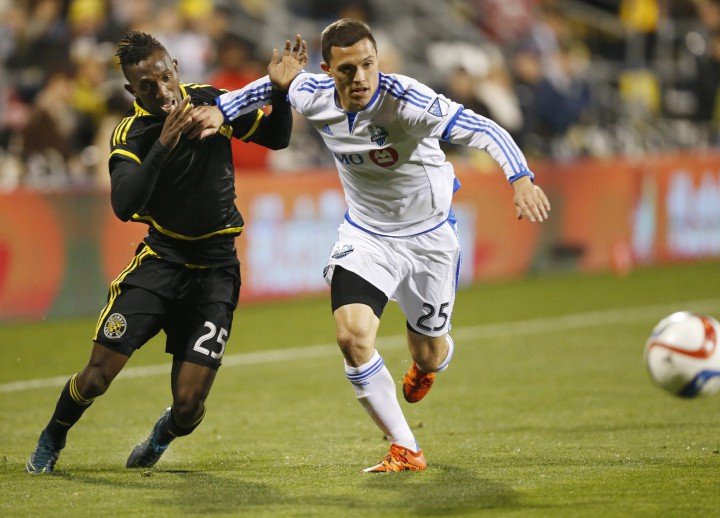Columbus Crew defender Harrison Afful (25) and Montreal Impact defender Donny Toia (25) go for the ball during the MLS playoff soccer game at Mapfre Stadium in Columbus, Ohio on Sunday, November 8, 2015.