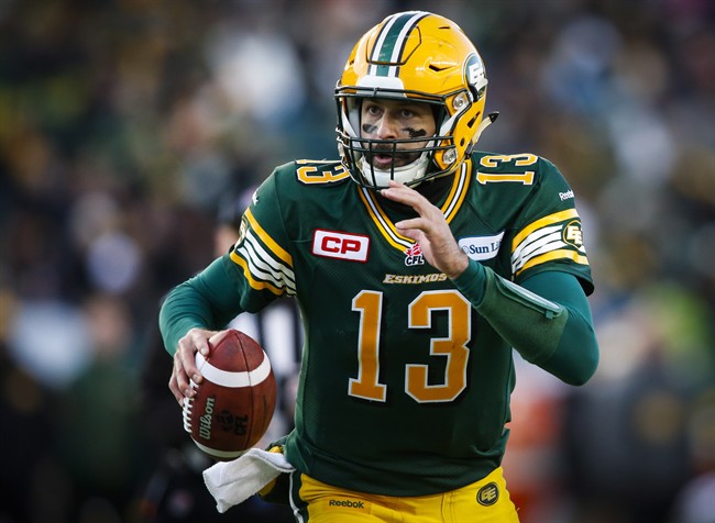 Edmonton Eskimos' quarterback Mike Reilly runs with the ball during first half CFL West Division final football action against the Calgary Stampeders in Edmonton, Sunday, Nov. 22, 2015.