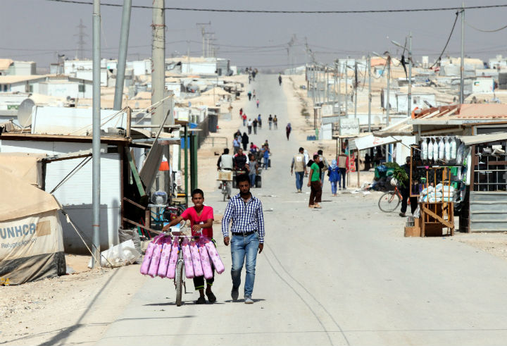 Syrian refugees walk at the Zatari Syrian Refugee Camp, northeast of Amman, Jordan, on Oct. 5, 2015.
