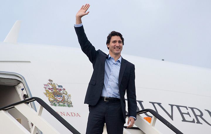 Prime Minister Justin Trudeau boards a government plane before leaving the United Kingdom Thursday November 26, 2015 in Luton, England. Trudeau is heading to Malta for the Commonwealths Heads of Government meeting. 