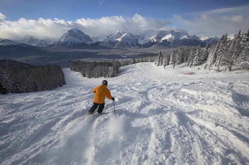 A skier enjoys fresh powder at the Lake Louise Ski Resort on November 18, 2015.