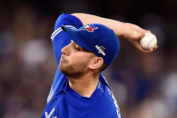 Toronto Blue Jays starting pitcher Marco Estrada delivers a pitch to the Kansas City Royals during second-inning of Game 5 of the American League Championship Series in Toronto on Wednesday, Oct. 21, 2015. 