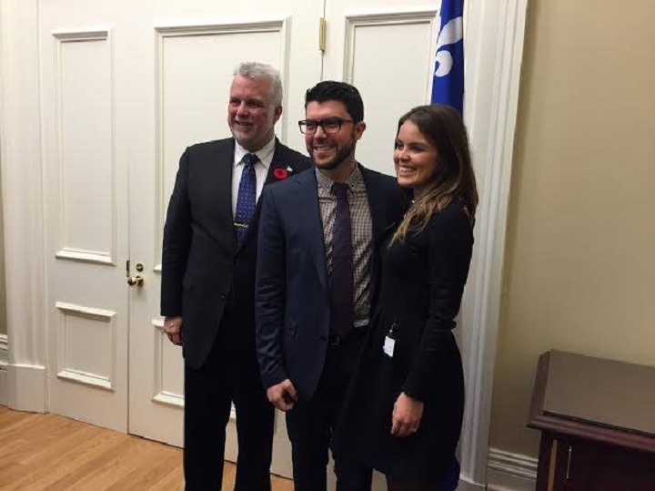 Matthew Schreindorfer and his wife, Katia Luciani pose for a picture with Quebec Premier Philippe Couillard.