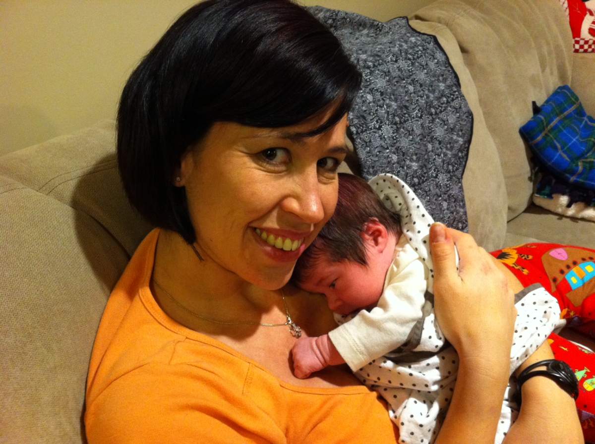 Me and Camryn at home when she was only a few days old.