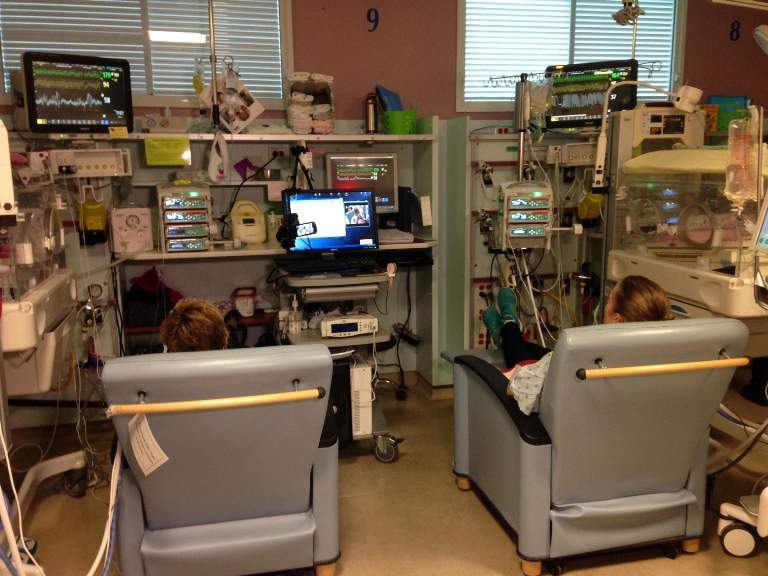 Two moms spend time with their preemie babies.