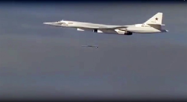 FILE - In this photo made from the footage taken from Russian Defense Ministry official web site on Tuesday, Nov. 17, 2015, a Russian Tu-160 bomber launches a cruise missile at a target in Syria.