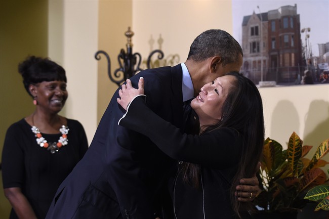 President Barack Obama hugs Sharon Boatwright during a visit to Integrity House, a residential facility in Newark, N.J., Monday, Nov. 2, 2015. Obama is calling for breaking the cycle of incarceration by helping former inmates successfully re-enter society. Boatwright is a resident and participant at Integrity and Shorter is Director of the Women's Outpatient Programs and Director of the Women's Half-Way House at Integrity House.
