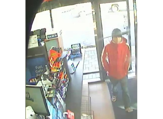 A screengrab of a man who robbed a poppy donation box from the Husky gas station in the 2000 block of Sumas Way on November 11, 2015. 