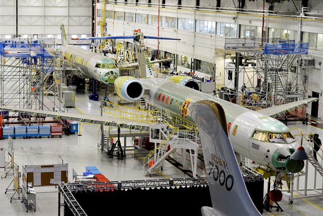 People tour the Bombardier Global 7000 aircraft and facility in Toronto on Tuesday, November 3, 2015. Prime Minister Justin Trudeau says if Bombardier Inc., needs federal money to aid its C Series jet project, it'll have to make a strong business case.