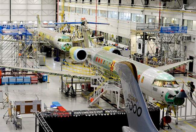 People tour the Bombardier Global 7000 aircraft and facility in Toronto. 