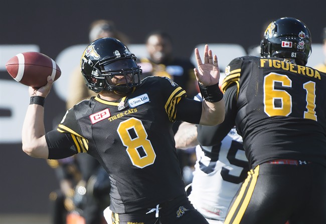 Head coach June Jones calls Jeremiah Masoli (8) and Zach Collaros "top flight" QBs, but admits they can't keep them both.