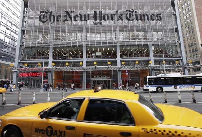In this Oct. 18, 2011 file photo, traffic passes the New York Times building, in New York. 